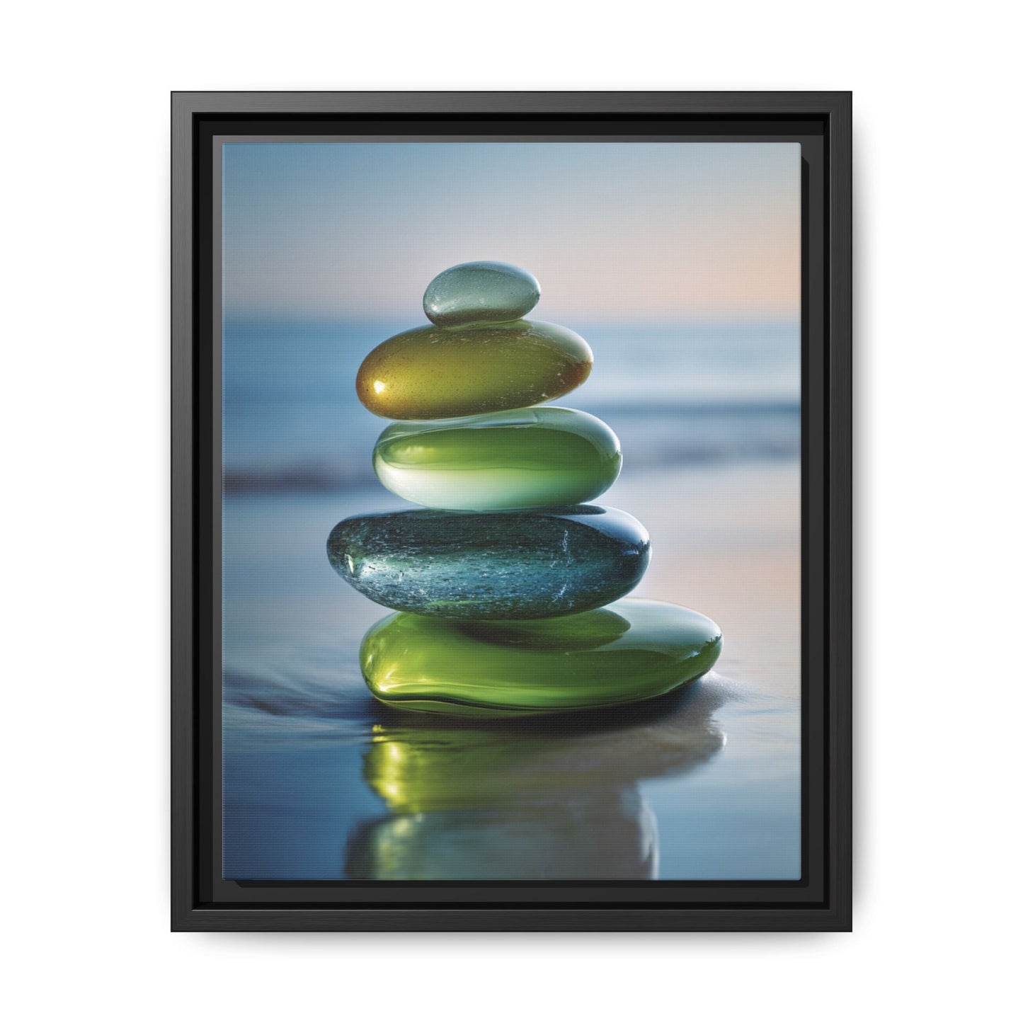 Calming Green Stones Framed Canvas Wall Art featuring stacked green stones with serene ocean background in black sustainable wood frame